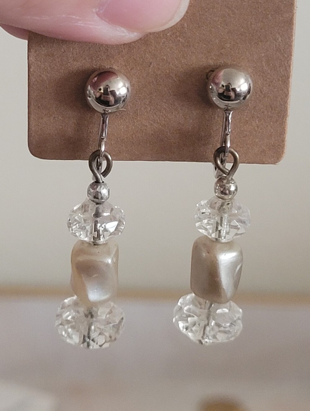 Silver earrings with clear beads and cream-colored pearl-like beads non-pierced